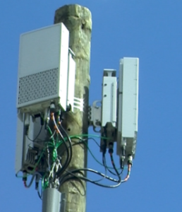 wood utility pole with equipment